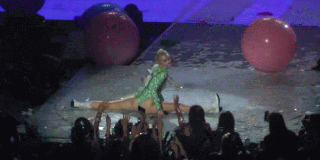 miley cyrus money suit twerking splits dancing tongue out on stage no shame gif
