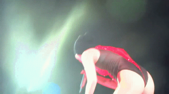 miley cyrus twerking her 12 yo looking ass on stage red jump suit gif