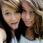 two beautiful young girls tongues out ready for facial